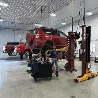 Person working on car | Don's Auto Service Inc